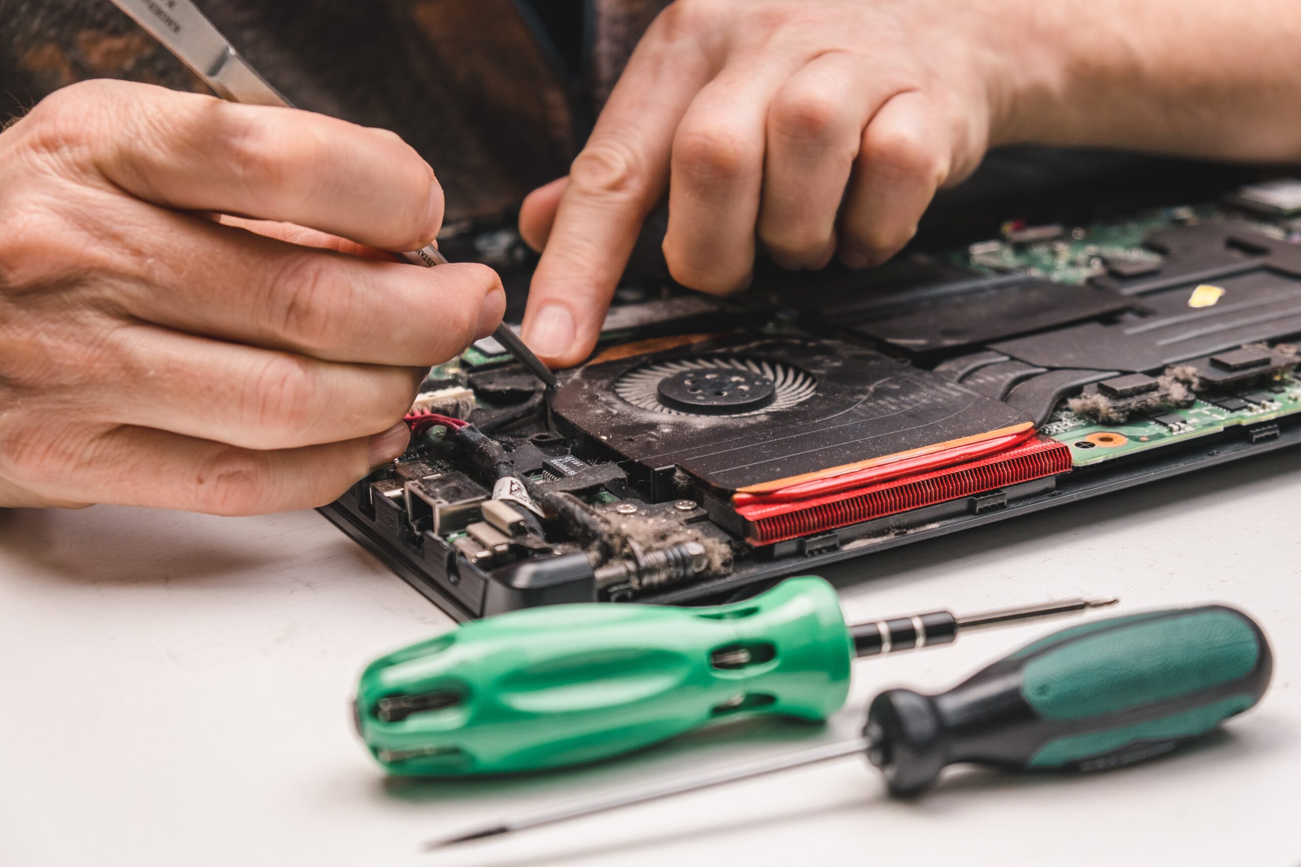 a-computer-repair-specialist-disassembles-and-clea-2023-11-27-05-07-26-utc